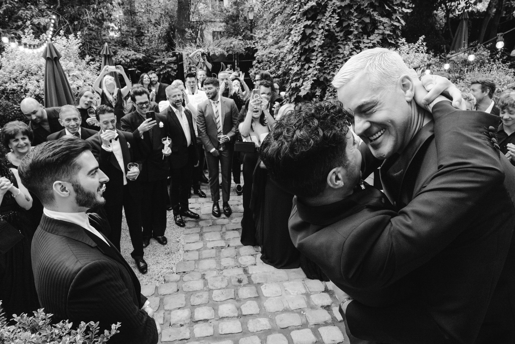 gay wedding first kiss during this ceremony in the gardens of Hotel Particulier Montmartre, Paris
