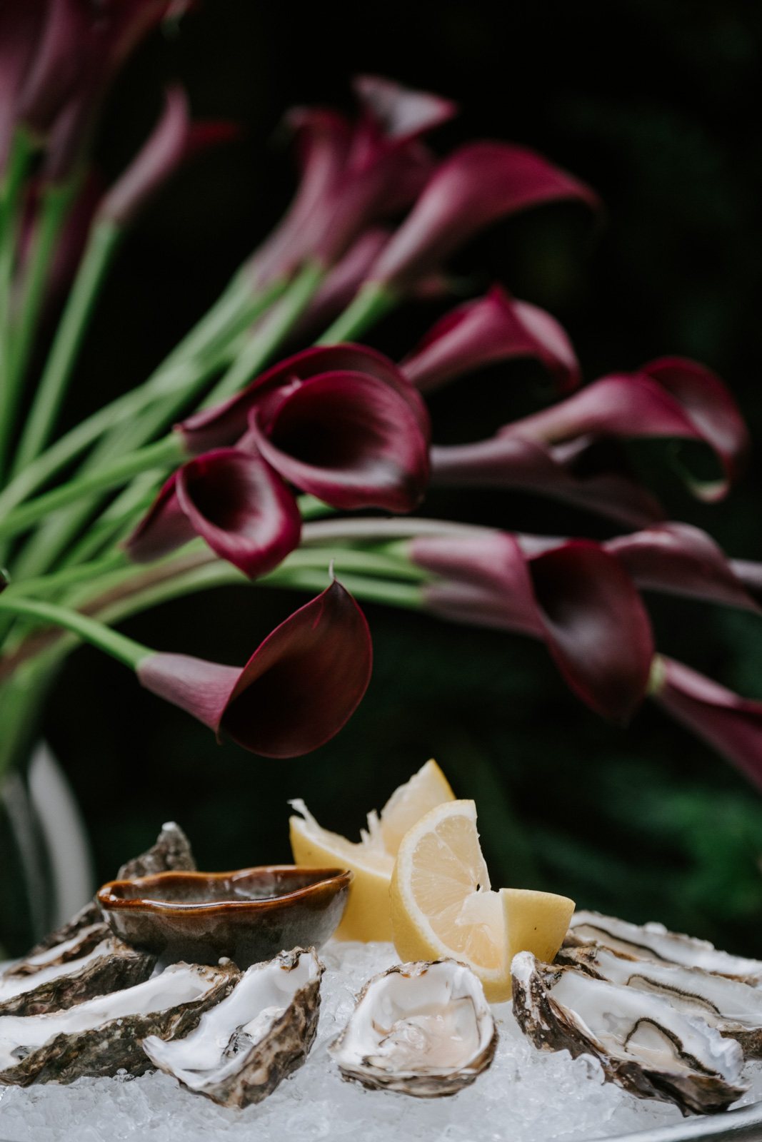 oysters and lilies during cocktail hour at this gay wedding at Hotel Particulier Montmartre, Paris