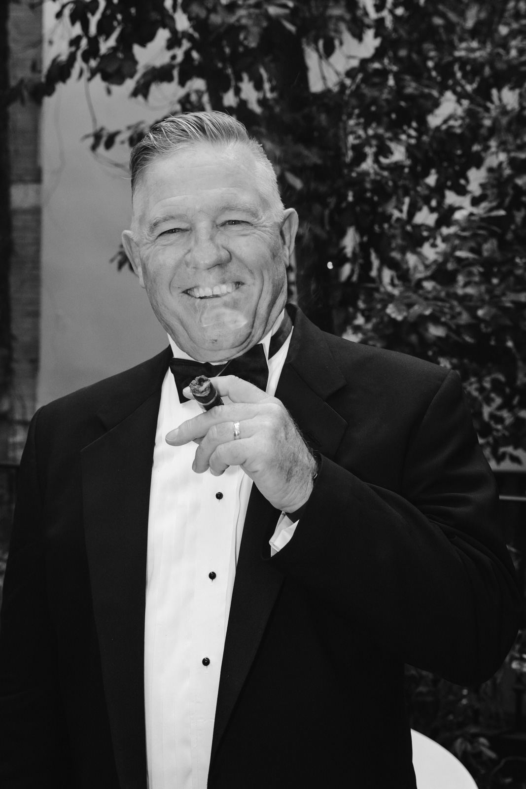 groom's dad portrait with a cigar at this gay wedding at Hotel Particulier Montmartre, Paris