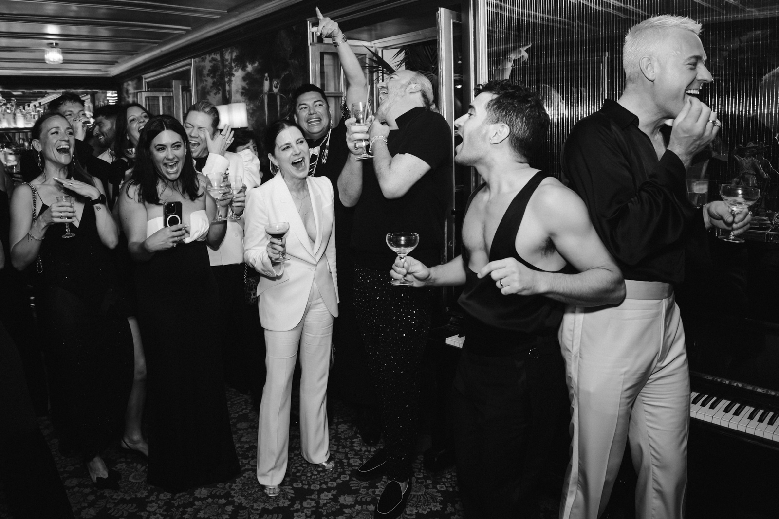 grooms laughing at speeches during party time at this gay wedding at Hotel Particulier Montmartre, Paris