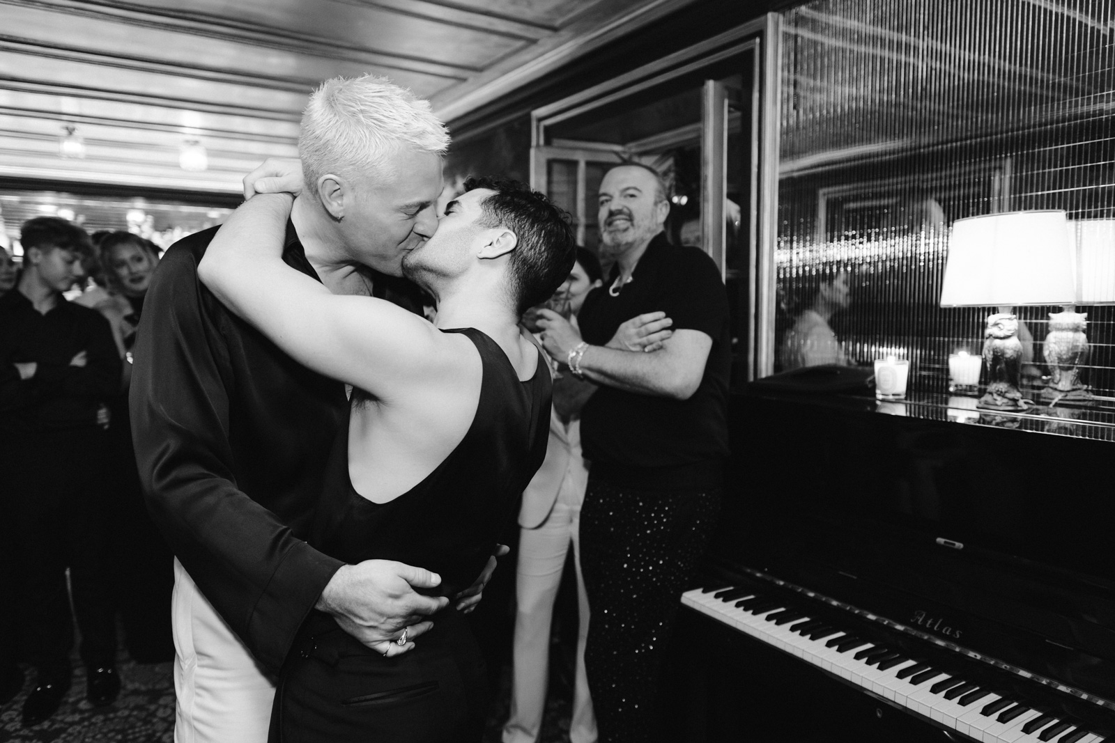 grooms kissing at the end of first dance during party time at this gay wedding in at Hotel Particulier Montmartre, Paris