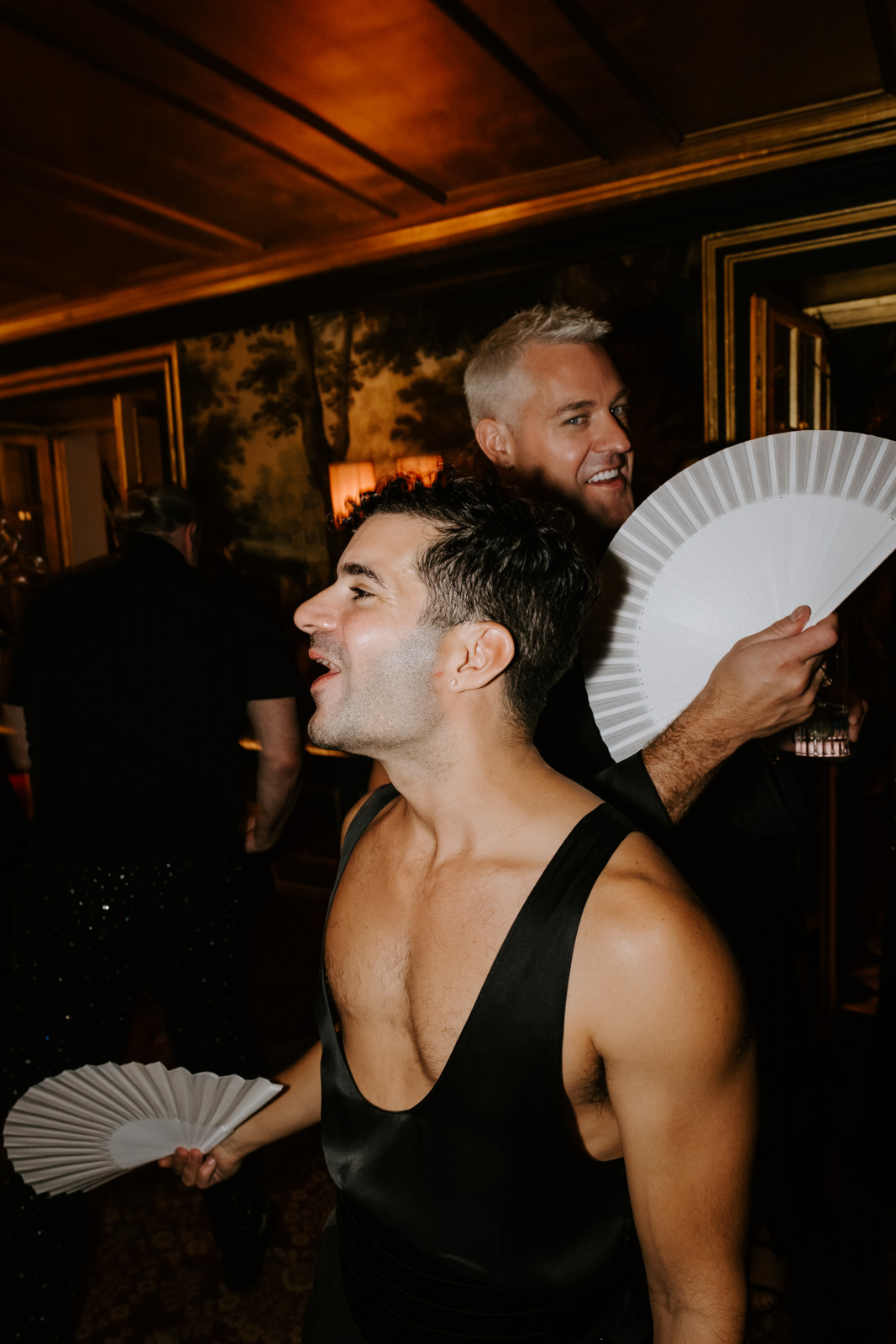 grooms having fun during party time at this gay wedding at Hotel Particulier Montmartre, Paris