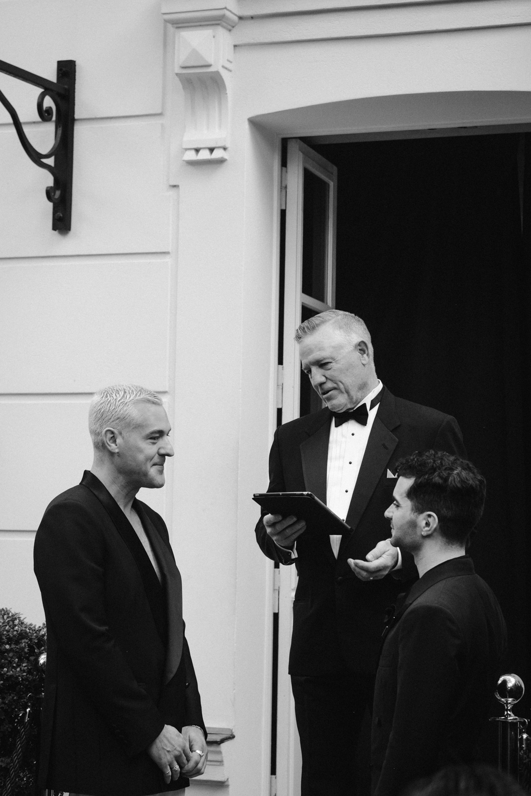 the dad of one of the grooms officiates this gay wedding in the garden of Hotel Particulier Montmartre, Paris
