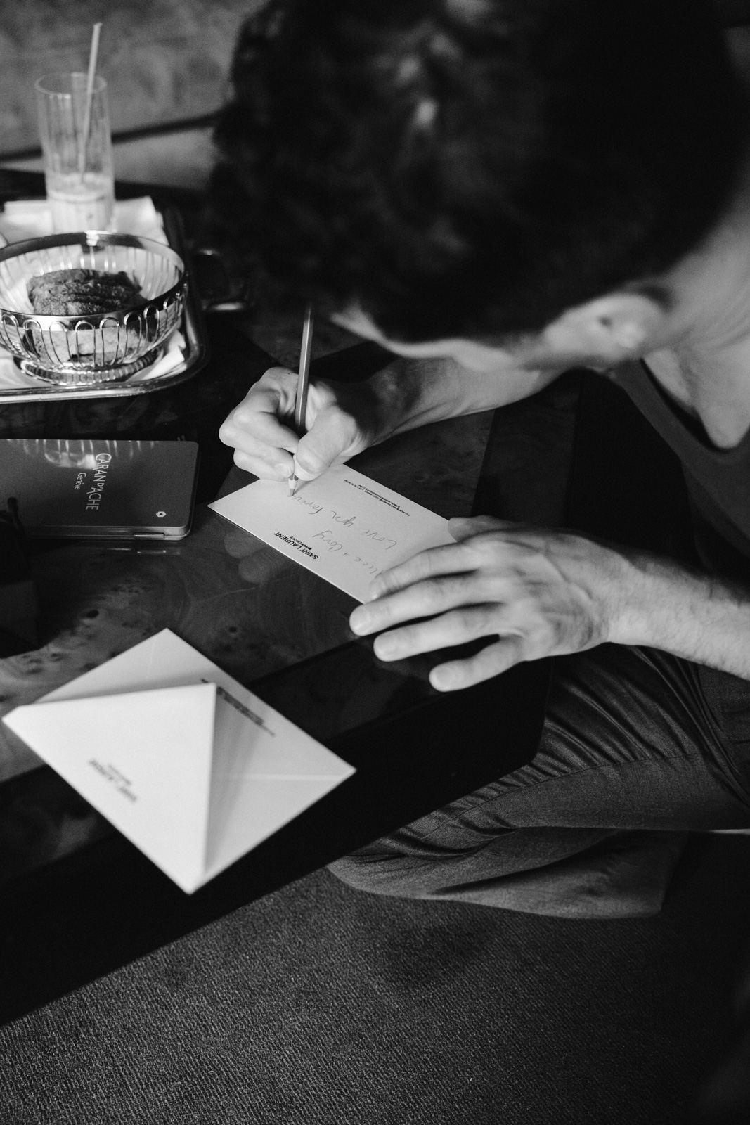 The grooms are getting ready for their ceremony at Hotel Particulier Montmartre, Paris, and writing notes to their wedding party