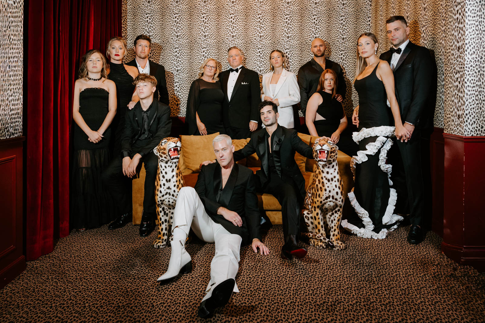Vogue-style wedding group shot in the leopard suite of Hotel Particulier Montmartre.