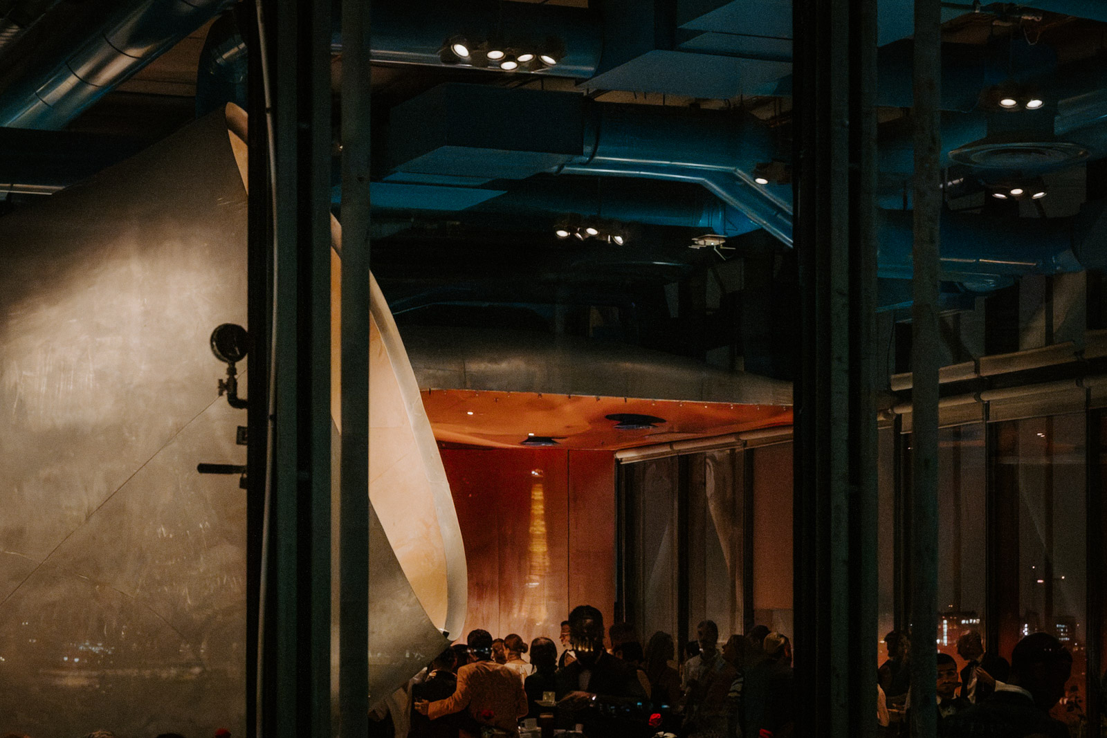 a larger viewpoint of the inside of Le Georges, the rooftop restaurant of Pompidou Centre in Paris where this wedding's welcome dinner happened